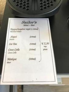 a white piece of paper on top of a machine at Sailor's Nautical Concept in Spetses