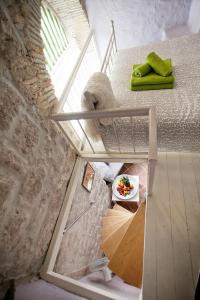 a view of a room with a bed and an umbrella at Aurora Tiny Apartment in Zadar