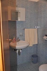 Ванная комната в Apartmani Komoseva