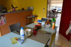 a table with food and drinks on top of it at Les Chambres de Carreau in Meilhan-sur-Garonne