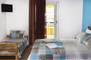 Postel nebo postele na pokoji v ubytování Souzana Rooms