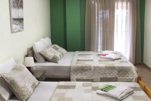 Postel nebo postele na pokoji v ubytování Souzana Rooms