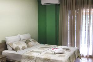 Postel nebo postele na pokoji v ubytování Souzana Rooms