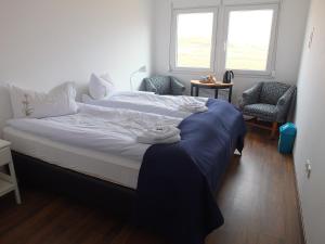 Säng eller sängar i ett rum på apartment Neðra-Vatnshorn