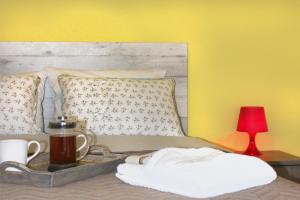 Postel nebo postele na pokoji v ubytování Souzana Rooms