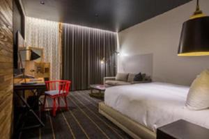 Postel nebo postele na pokoji v ubytování The George, by Valencia Hotel Collection