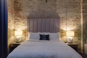 Postel nebo postele na pokoji v ubytování Hotel Trundle