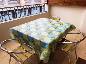 a table with a table cloth on it with two chairs at Sun Moon Beauty in Yuchi