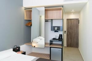 Postel nebo postele na pokoji v ubytování Renieris Hotel