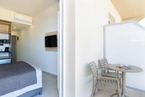 TV a/nebo společenská místnost v ubytování Renieris Hotel