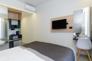 Postel nebo postele na pokoji v ubytování Renieris Hotel