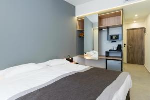 Postel nebo postele na pokoji v ubytování Renieris Hotel