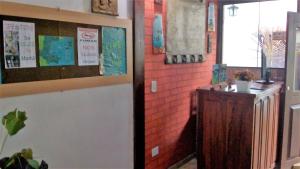 a room with a hallway with a counter and a window at Suites Pouso Familiar José e Maria in Paraty +42 photos