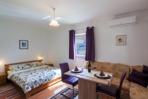 Ένα ή περισσότερα κρεβάτια σε δωμάτιο στο Apartment Monica