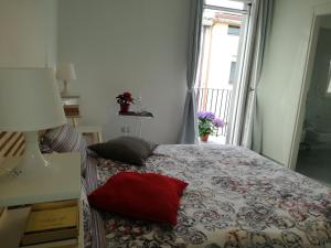 a bedroom with a bed and a dresser at AdagioRooms in Elmas
