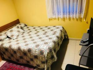 A bed or beds in a room at Pensión la Estación