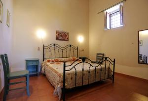Un pat sau paturi într-o cameră la Vacanze Il Sultano