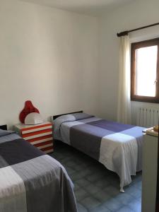 Tempat tidur dalam kamar di Villetta Scossicci