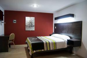 Postel nebo postele na pokoji v ubytování Hotel Onix Suites