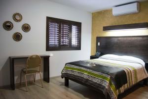 Krevet ili kreveti u jedinici u okviru objekta Hotel Onix Suites