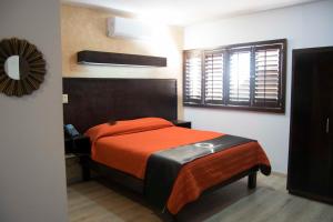 Postel nebo postele na pokoji v ubytování Hotel Onix Suites