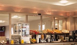 a bakery counter with many different types of bread at Ace Hotel Poitiers in Poitiers
