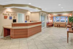 a lobby of a hospital with a waiting room at Microtel Inn & Suites by Wyndham Hattiesburg in Hattiesburg