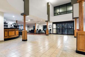 a large room with a kitchen and a lobby at Wingate by Wyndham Athens GA in Athens