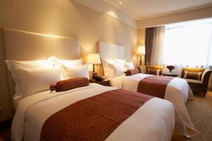 Postel nebo postele na pokoji v ubytování Shanghai Fenyang Garden Boutique Hotel