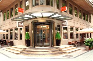 an entrance to a building with a revolving door at Midtown Hotel in Istanbul