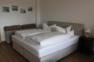 Postel nebo postele na pokoji v ubytování Hotel Fresena