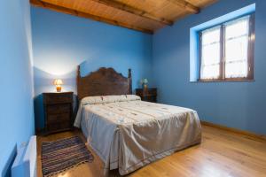 سرير أو أسرّة في غرفة في Casa Aniceto