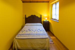 En eller flere senge i et værelse på Casa Aniceto