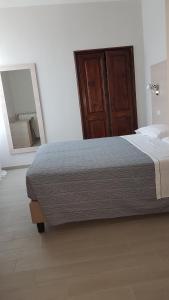 Cecio 5 Terre Rooms tesisinde bir odada yatak veya yataklar