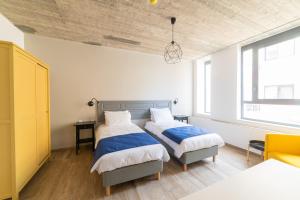 Voodi või voodid majutusasutuse Chapter 5 Hotel toas