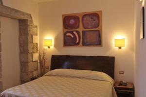 Кровать или кровати в номере Hotel Villa Pimpina