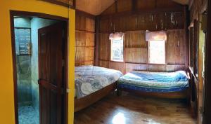 Postel nebo postele na pokoji v ubytování Pencave Homestay