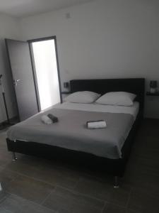 Postel nebo postele na pokoji v ubytování Apartmani Gojko