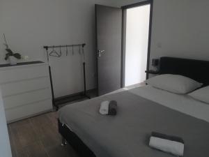 Postel nebo postele na pokoji v ubytování Apartmani Gojko