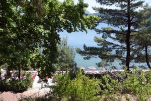 a view of a beach with trees and the water at Marmaris Park Hotel in Marmaris