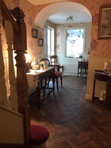 a living room with a table and a window at Beau Vista in Strabane