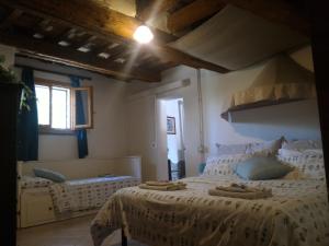 a bedroom with a large bed and a window at Appartamenti in Villa Shanti in Rimini