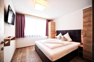 Postel nebo postele na pokoji v ubytování Amaris Apartments