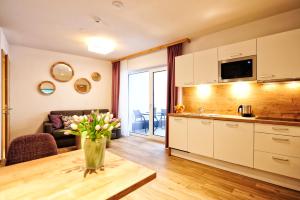 Kuchyň nebo kuchyňský kout v ubytování Amaris Apartments