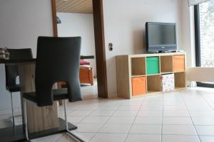TV a/nebo společenská místnost v ubytování Ferienwohnung Friedsam