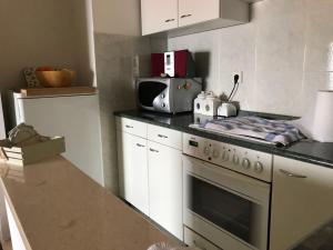 Kuchyň nebo kuchyňský kout v ubytování Beach apartmant