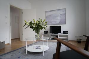 TV a/nebo společenská místnost v ubytování Altstadtwohnung mit eigenem Hauseingang