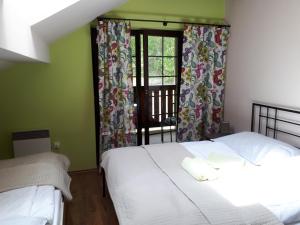 מיטה או מיטות בחדר ב-Hrabovo Barbora 19