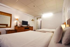 Letto o letti in una camera di 知本溫泉の旅宿