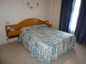 A bed or beds in a room at Hotel Silos 2000